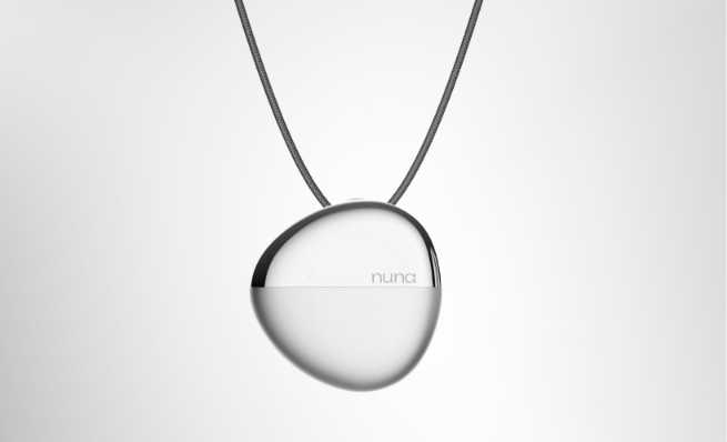Woman wearing NUNA silver pendant