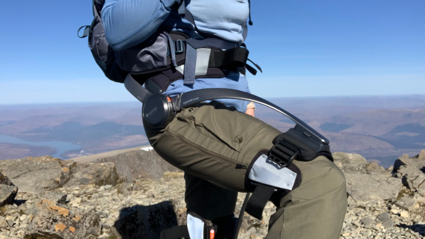 Exoskeleton on mountain peak with scenic view