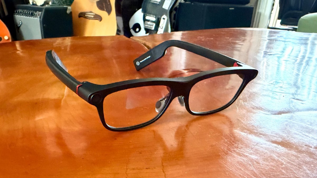 INMO GO3 smart glasses resting on a wooden table