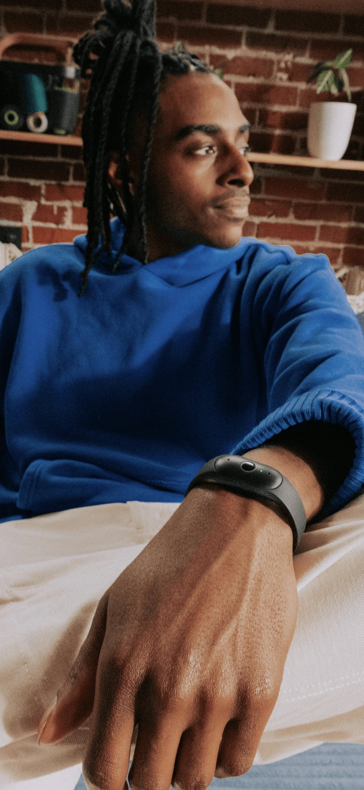 Portrait of a user wearing Bee wearable at home